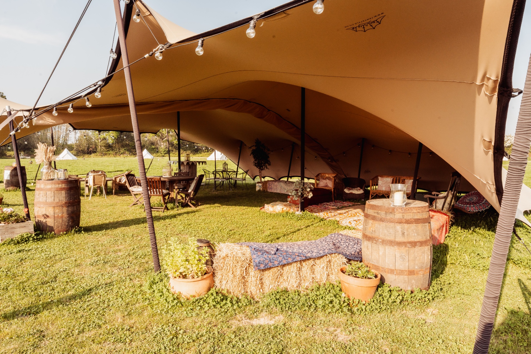 Stretch tent set up on the meadow at Caracol Glamping
