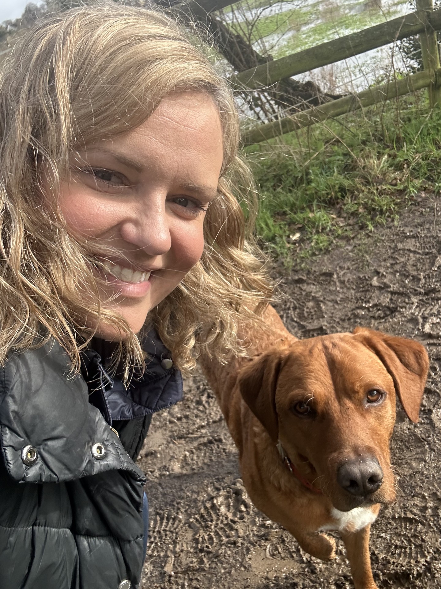 Sarah Bohn and Anderson the dog on a muddy walk
