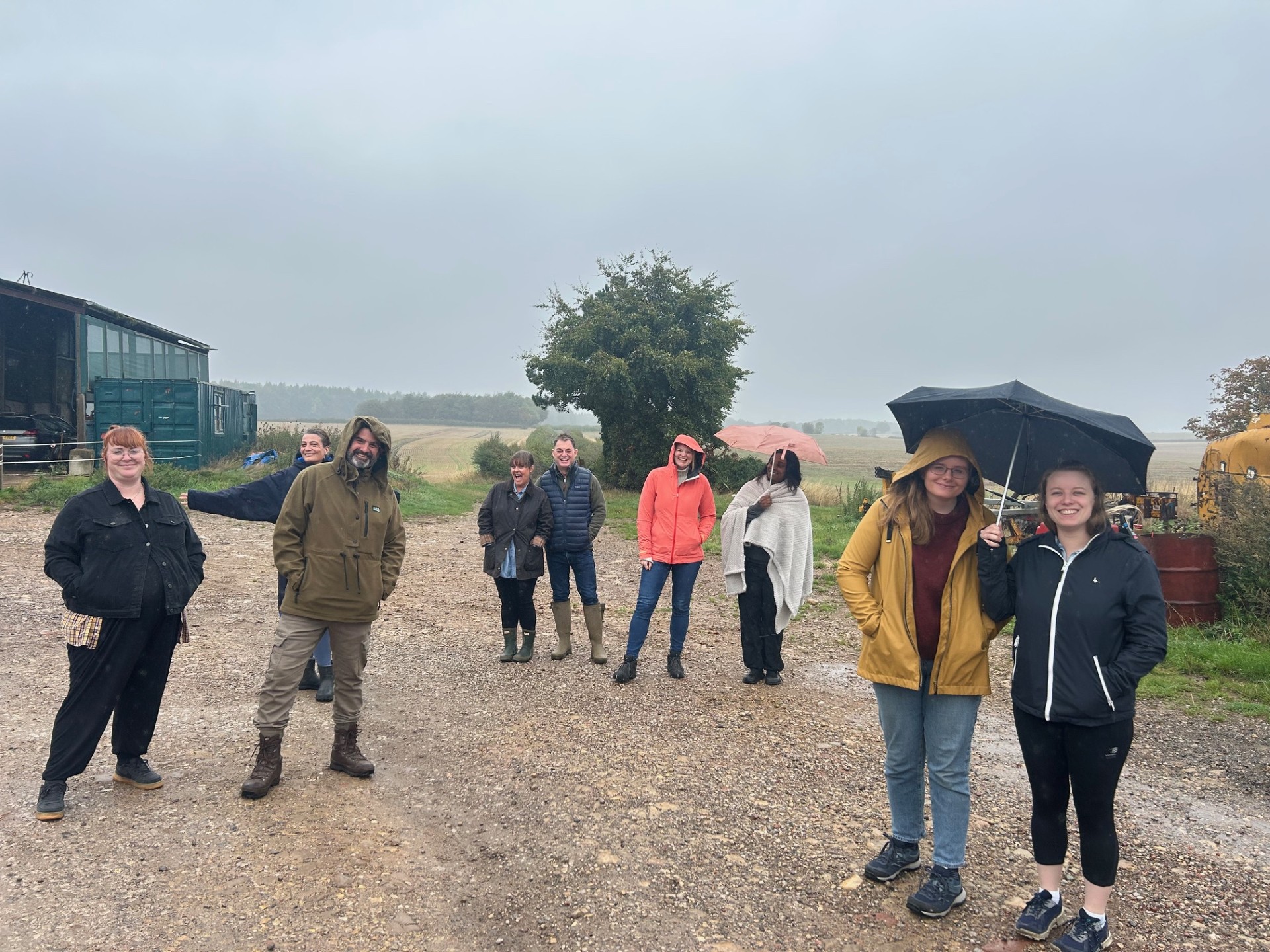 Retreat group on a farm walk in the rain
