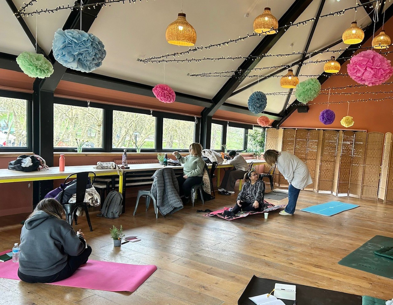 Mindfulness session with yoga mats and fairy lights